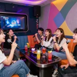 Vibrant karaoke lounge experience showcasing the nightlife culture at www.3no.org with friends enjoying cocktails and singing in colorful surroundings.